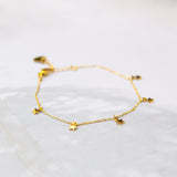 Subtiele schakelarmband met vijf gouden sterretjes