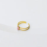 Verstelbare gouden ring met roze ovale steen 